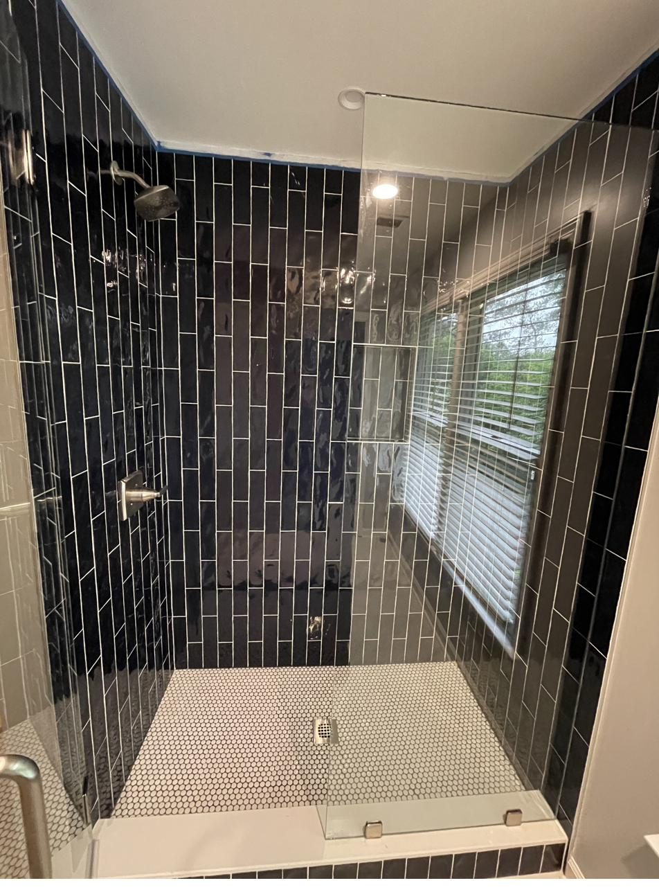Bathroom — bold black tile shower